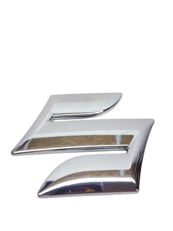 Emblemat Suzuki SX4 77811-54GC0-OPG